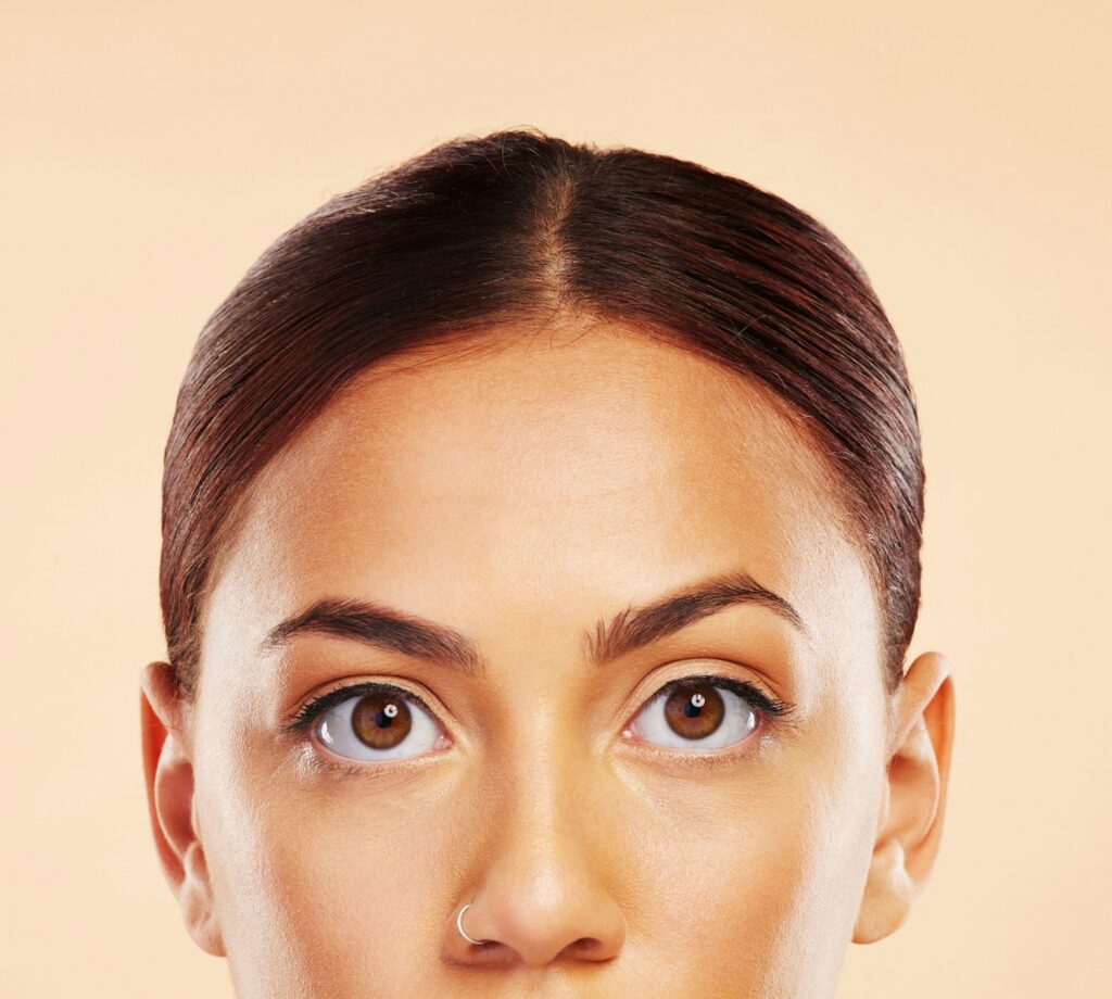 Face, skincare mockup or portrait of woman in studio isolated on beige background for a beauty aest